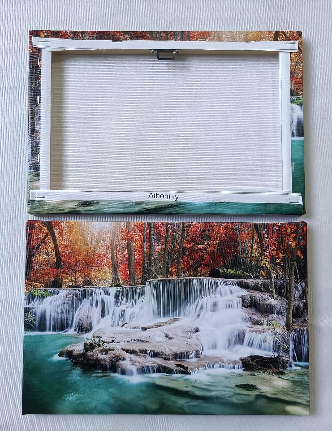 Framed canvas wall print featuring modern forest waterfall landscape with warm earth tones and red accents, ready to hang — view 4
