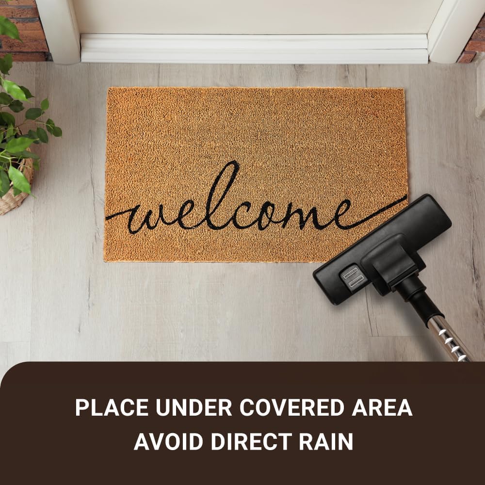 Rectangular coco coir door mat with rubber backing in neutral tone, shown at entryway entrance — view 4