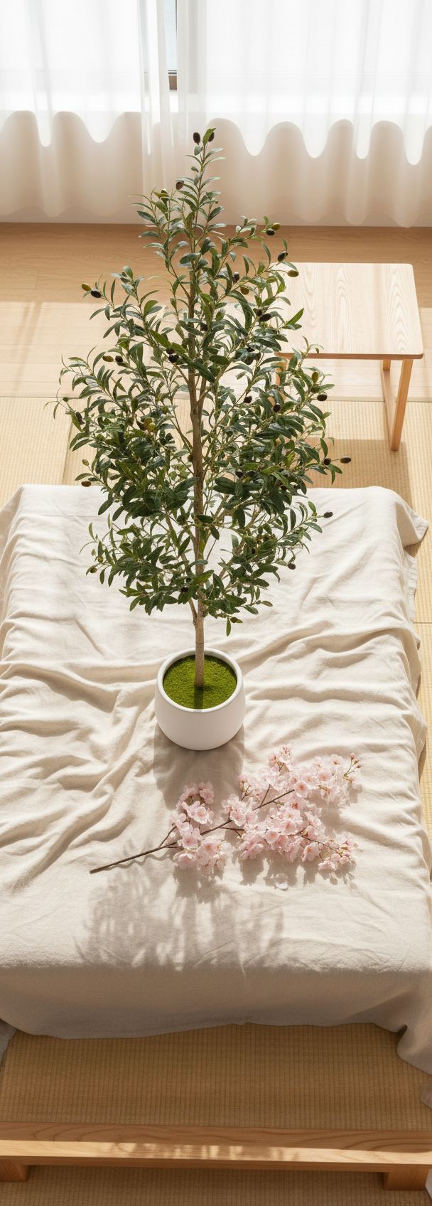 6-foot tall faux olive tree with realistic green polyethylene foliage, natural wood trunk, and white ceramic pot — view 5a