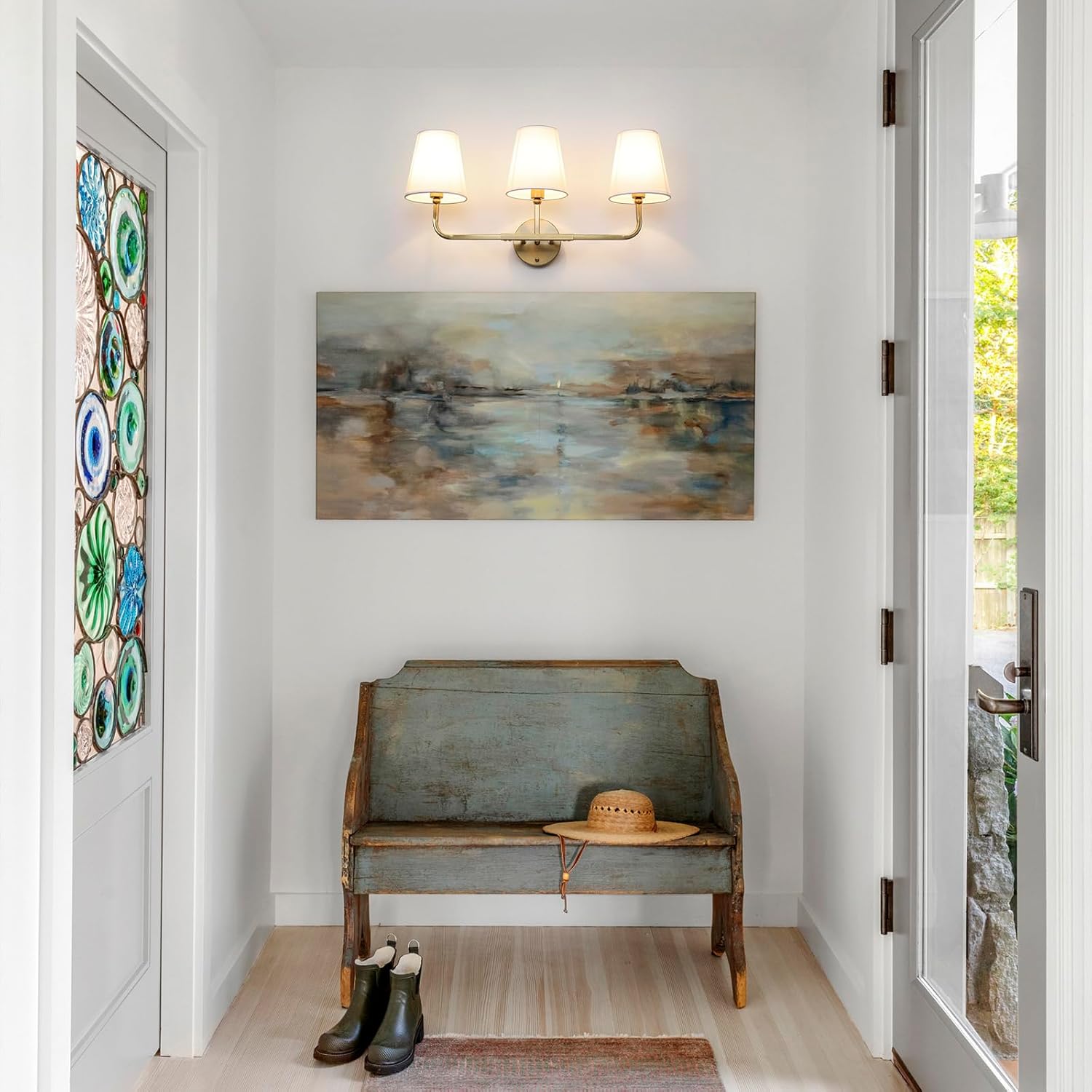 [Color]-finished brass 3-light wall sconce with white fabric drum shades, mounted above bathroom mirror — view 5