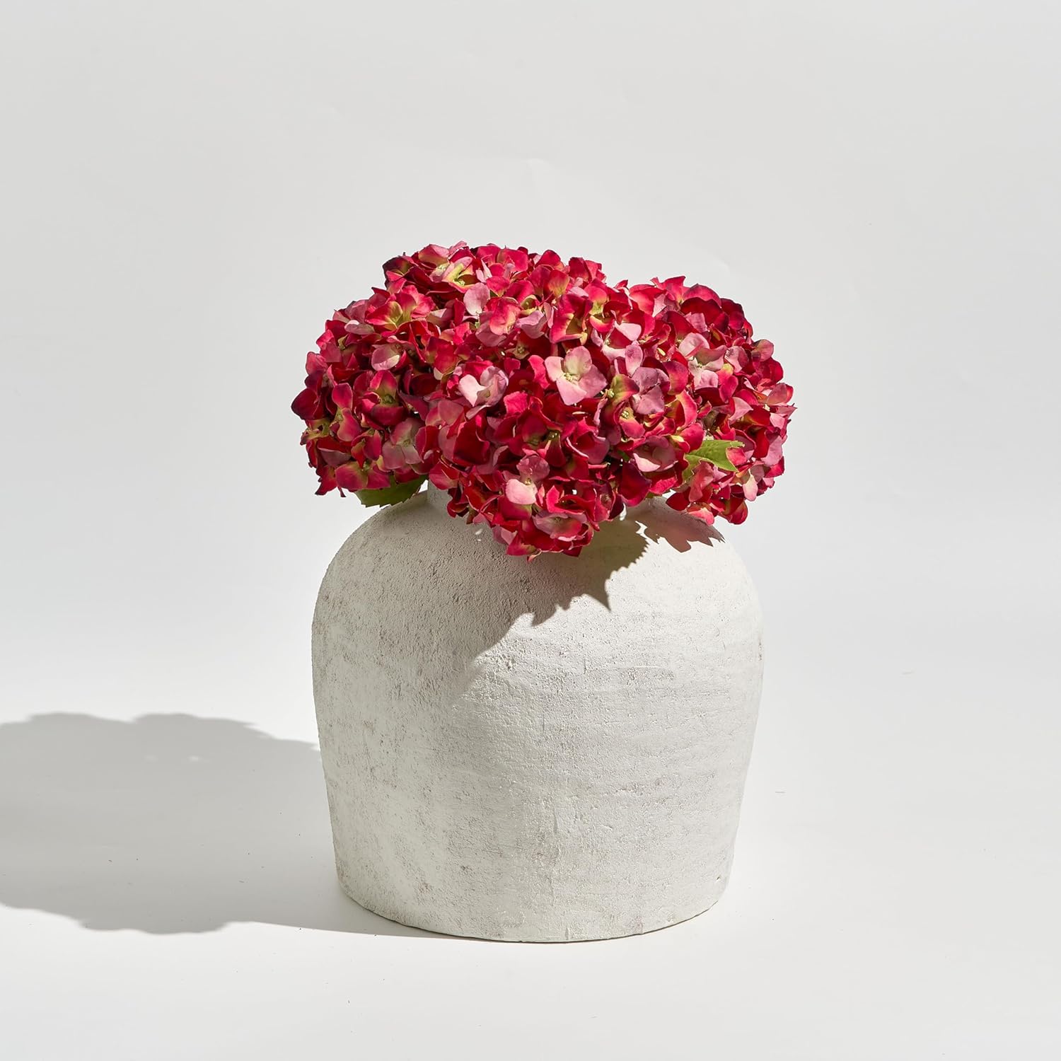 11-inch white ceramic vase with distressed farmhouse finish, shown in {color} against {background} — view 4