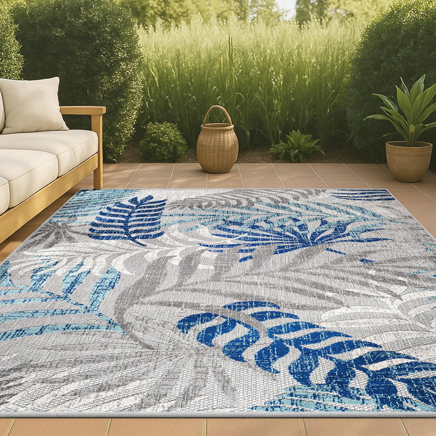 8x10 boho palm leaf area rug in sage blue and gray, indoor-outdoor synthetic fibers for patio and living room — detail