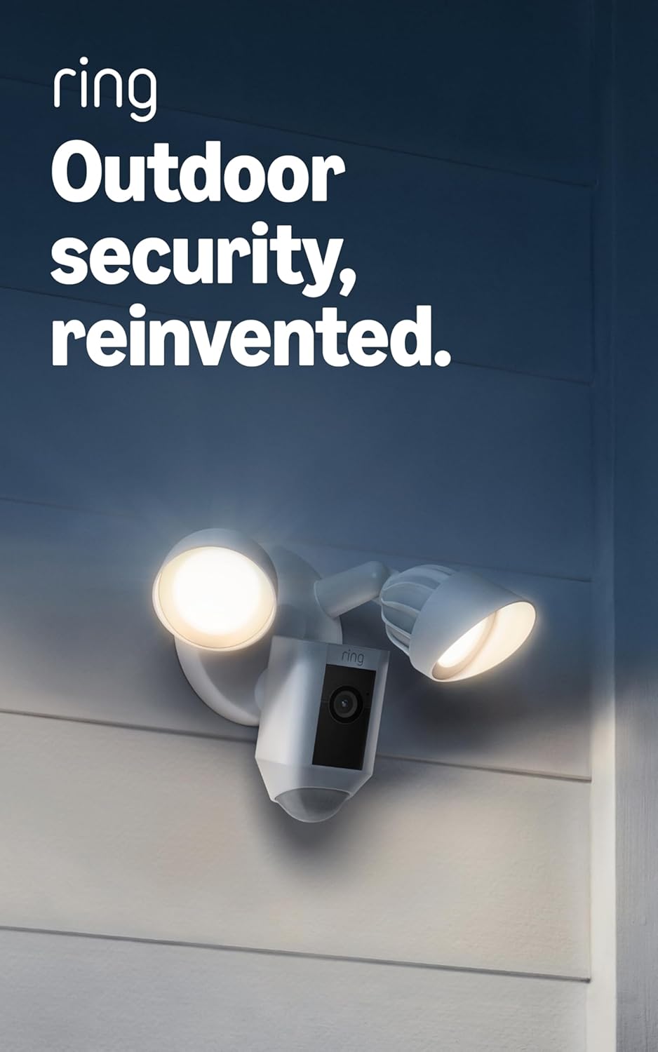 White plastic outdoor floodlight camera with LED lights and glass lens mounted on entryway — view 1