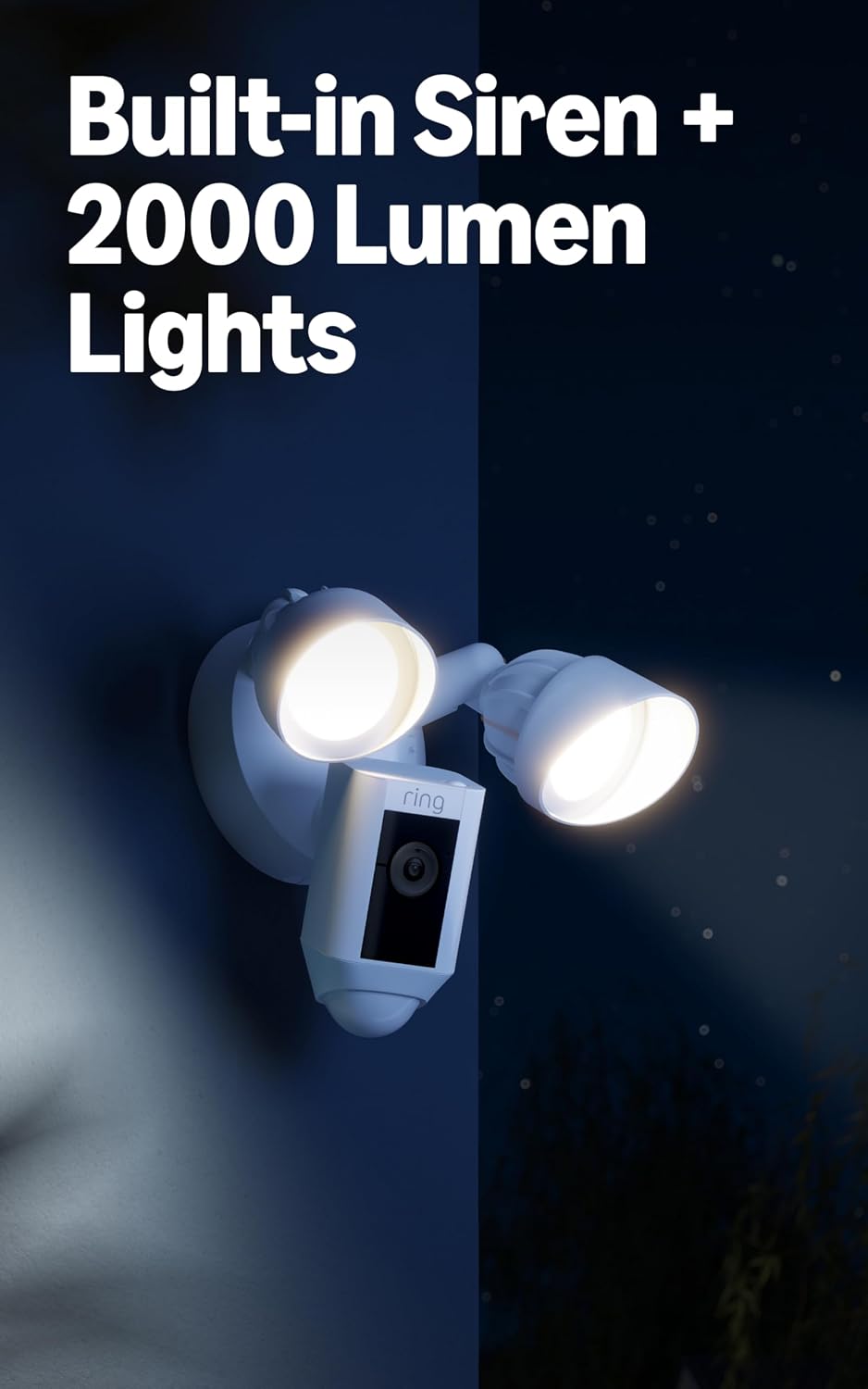 White plastic outdoor floodlight camera with LED lights and glass lens mounted on entryway — view 2