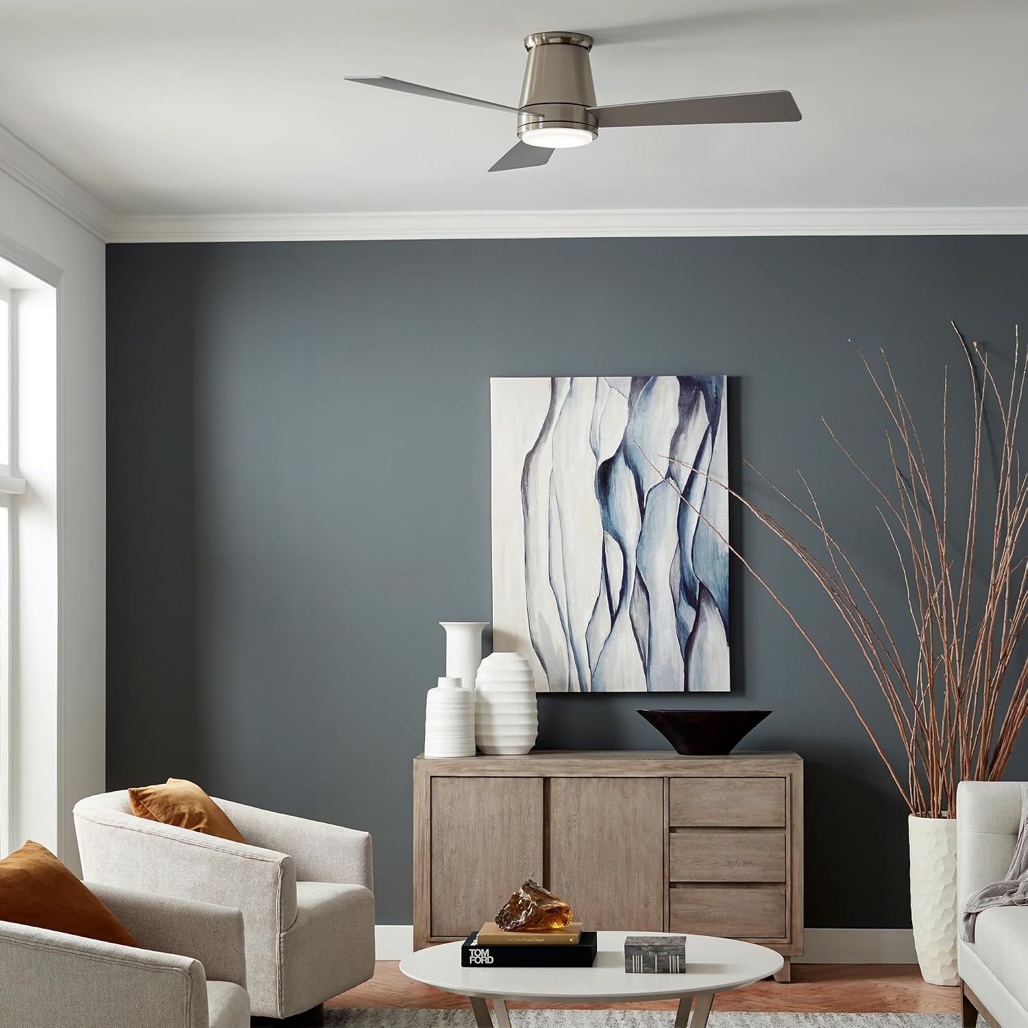 Matte white aluminum flush mount ceiling fan with three blades shown from below against ceiling in modern living room setting — hero view 1