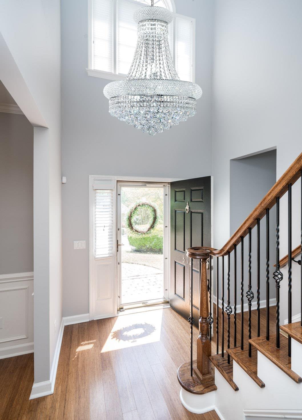 12-light chrome and crystal chandelier with brass accents, empire-style frame, 22 inch diameter — view 2