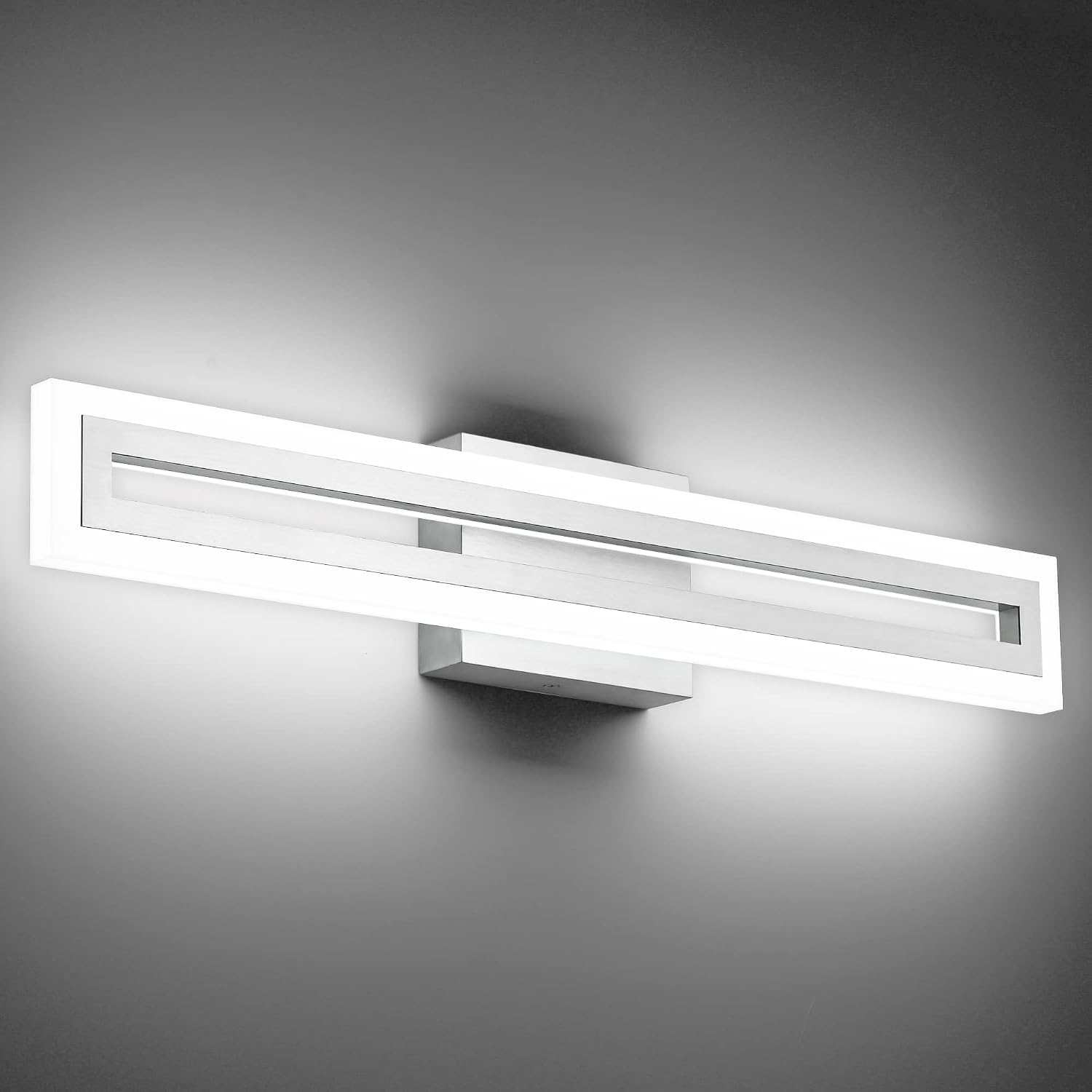 Brushed nickel LED vanity light fixture mounted above bathroom mirror, modern minimalist design with cool-tone lighting — view 1