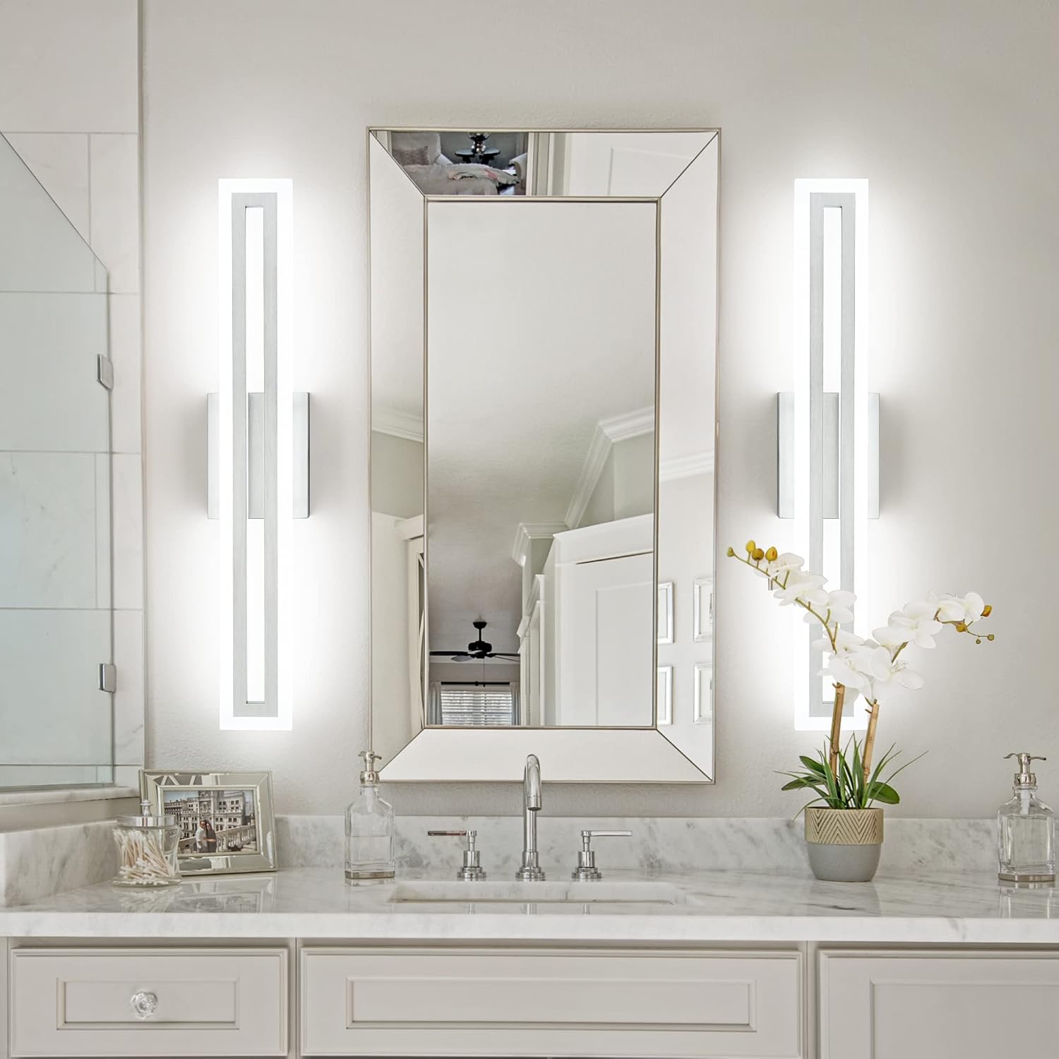 Brushed nickel LED vanity light fixture mounted above bathroom mirror, modern minimalist design with cool-tone lighting — view 3
