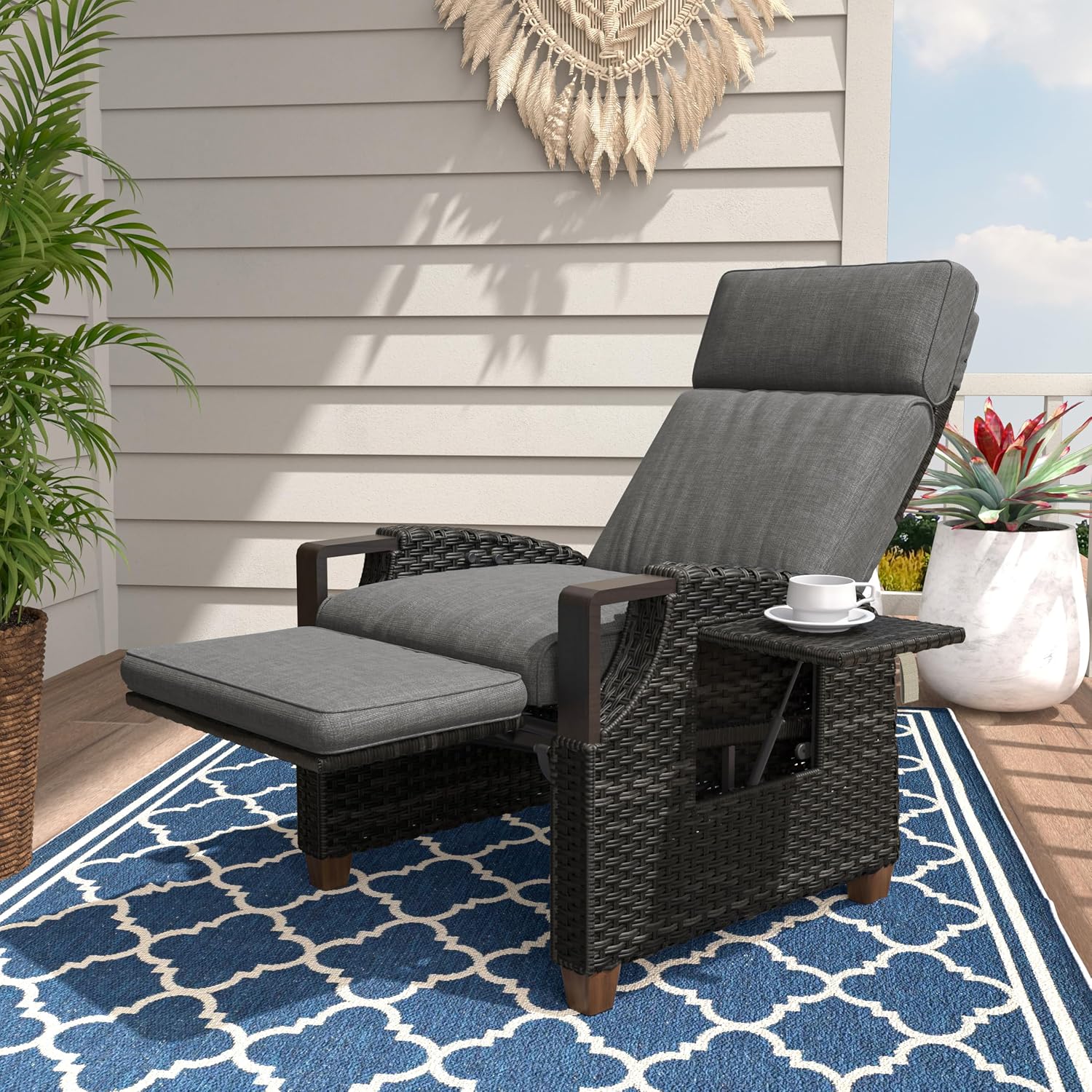 Grey wicker outdoor recliner with Olefin cushion, adjustable back and footrest in [angle view], metal frame construction — front