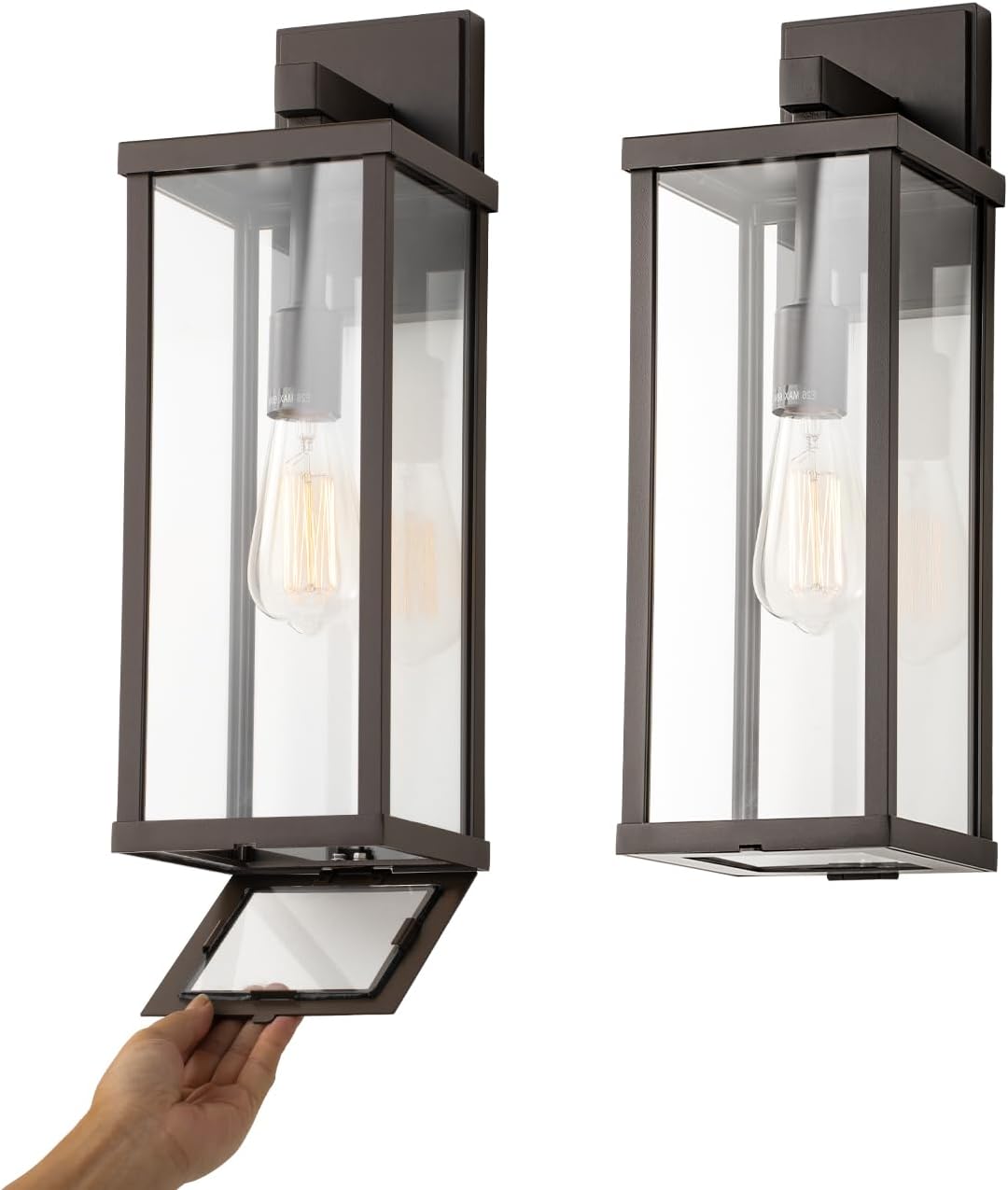 Matte black metal rectangular outdoor wall sconce with clear glass shade, shown mounted on porch exterior — view 3a