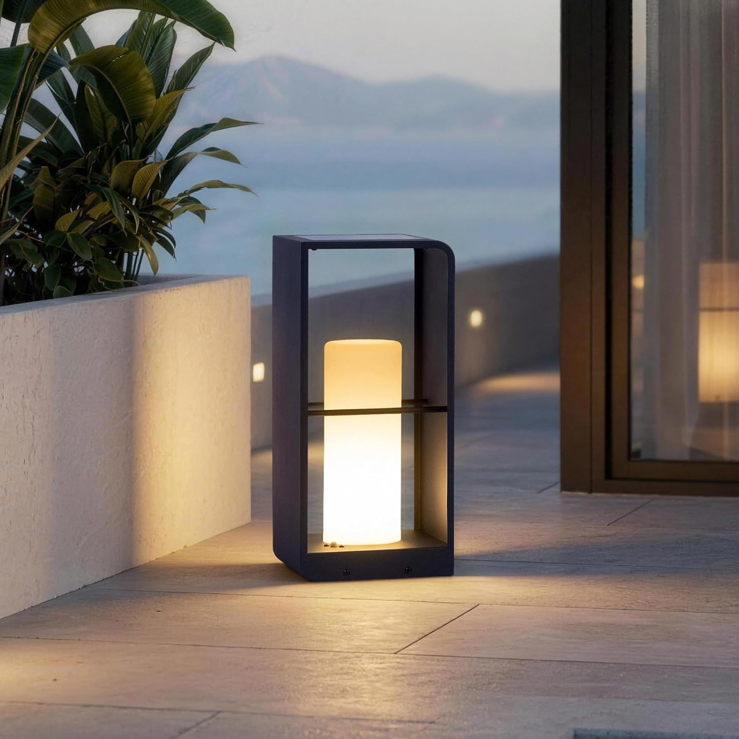 Modern solar floor lamp in neutral aluminum finish with tempered glass panels, shown in outdoor patio setting — front