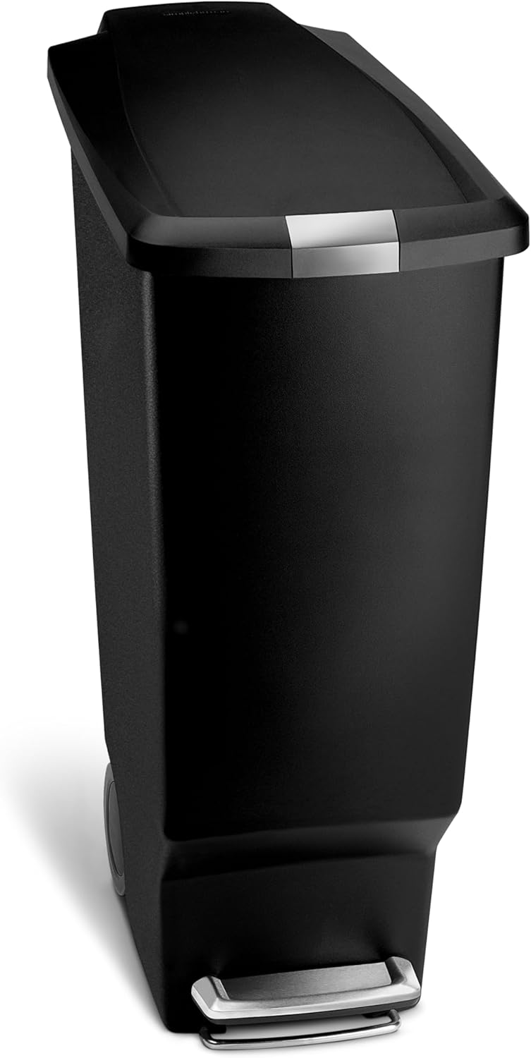 Minimalist black plastic step trash can with secure slide lock mechanism, front view — view 1