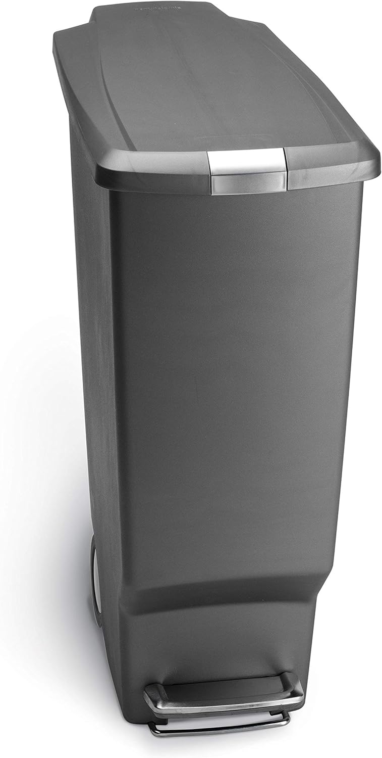 Minimalist black plastic step trash can with secure slide lock mechanism, front view — view 5