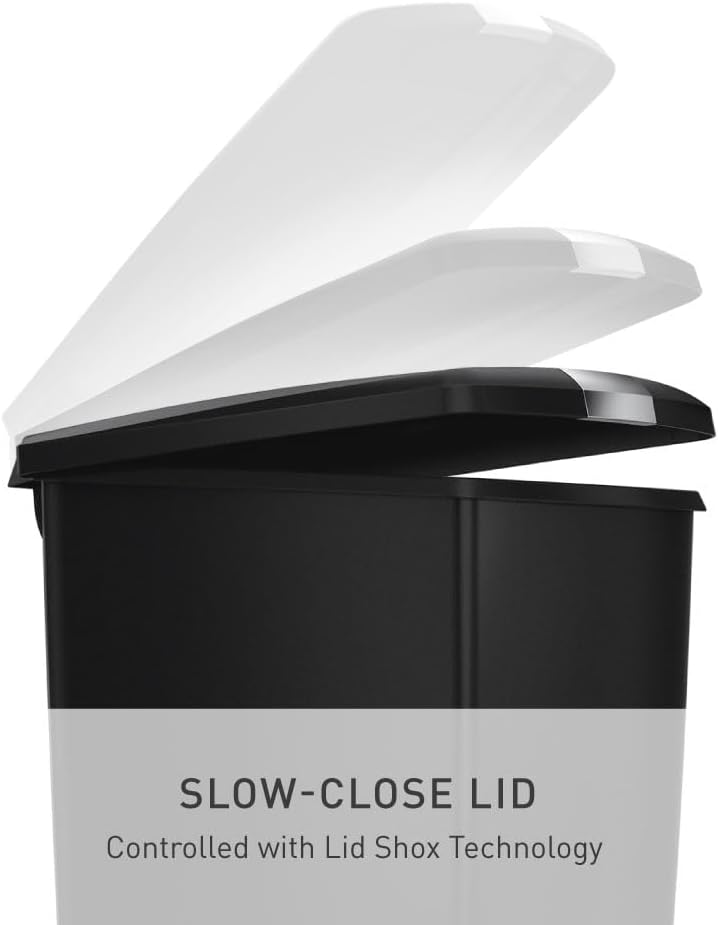 Minimalist black plastic step trash can with secure slide lock mechanism, front view — view 7
