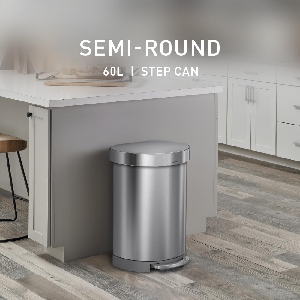Brushed stainless steel semi-round step trash can with metal pedal and silent-close lid, shown in modern kitchen setting — back