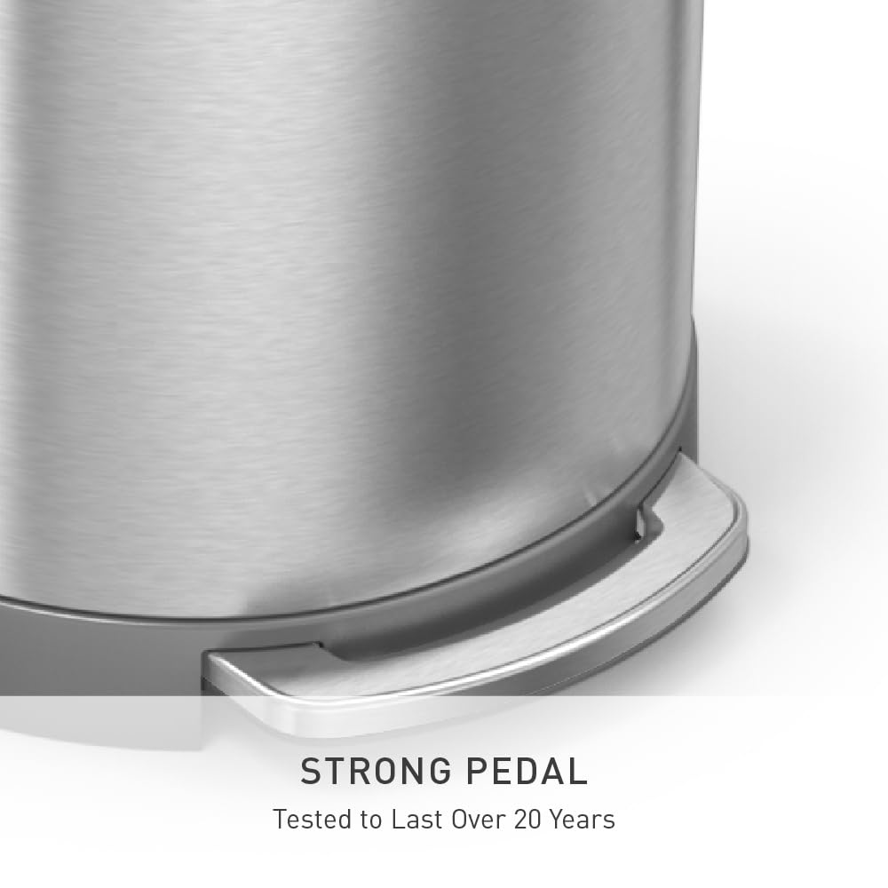 Brushed stainless steel semi-round step trash can with metal pedal and silent-close lid, shown in modern kitchen setting — view 2
